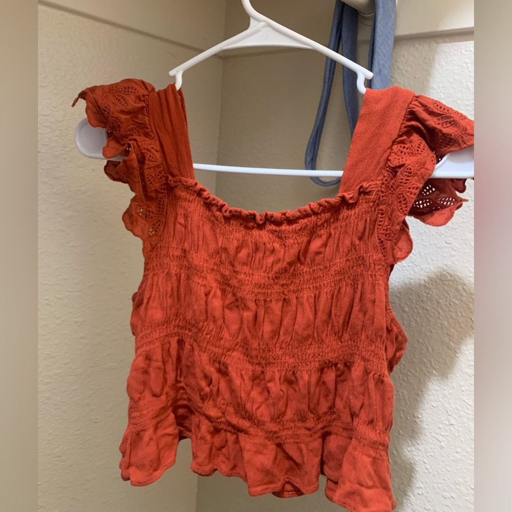 Orange flowy tank with fitted body